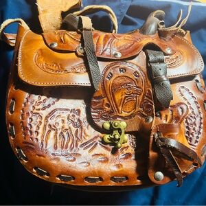 Handcrafted Embossed Leather Shoulder Bag designed like a saddle